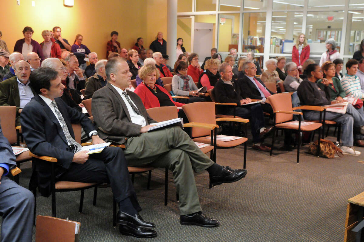 Stamford's Director of Administration Michael Handler and Public Safety Director Ted Jankowski listen as the League of Women Voters holds a forum to discuss the proposed charter changes at the Harry Bennett Branch Library in Stamford, Conn., Oct. 24, 2012. The 17th Charter Revision Commission and the Special Charter Committee of the Board of Representatives answered questions about the 9 charter-related questions on the November ballot.
