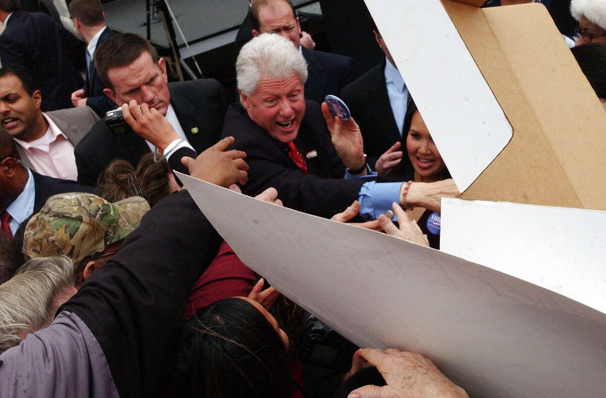 Bill Clinton reaches out to shake hands with guests at a rally in downtown Beaumont on Wednesday. Campaigning for his wife Hillary Clinton, the former president also spoke to Hispanic city leaders in a private meeting prior to the rally. February 20, 2008 Photo by Guiseppe Barranco