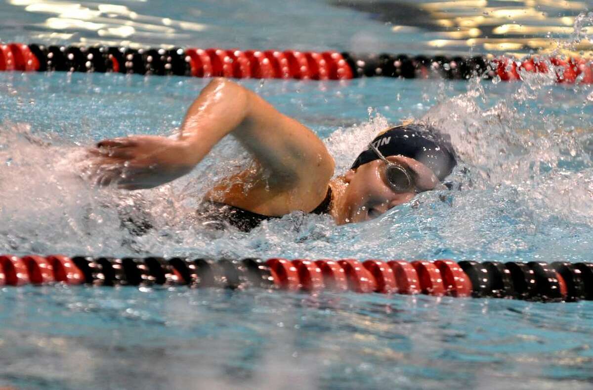 Weston's Shelby Fortin competes in the 200 yard freestyle event during the CIAC Class S Girls Swimming Championship at Wesleyan University pool in Middletown on Tuesday, Nov. 17, 2009.