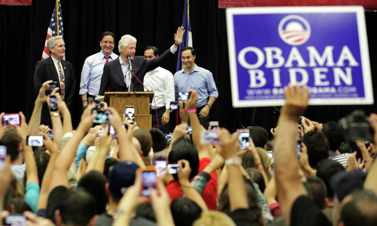 Former President Bill Clinton greets the crowd at South San High School in San Antonio to show support for Pete Gallego and other Democrats running in the upcoming election. Behind him are Lloyd Doggett, Pete Gallego, Julian Castro, and Joaquin Castro. Thursday, Oct. 25, 2012.
