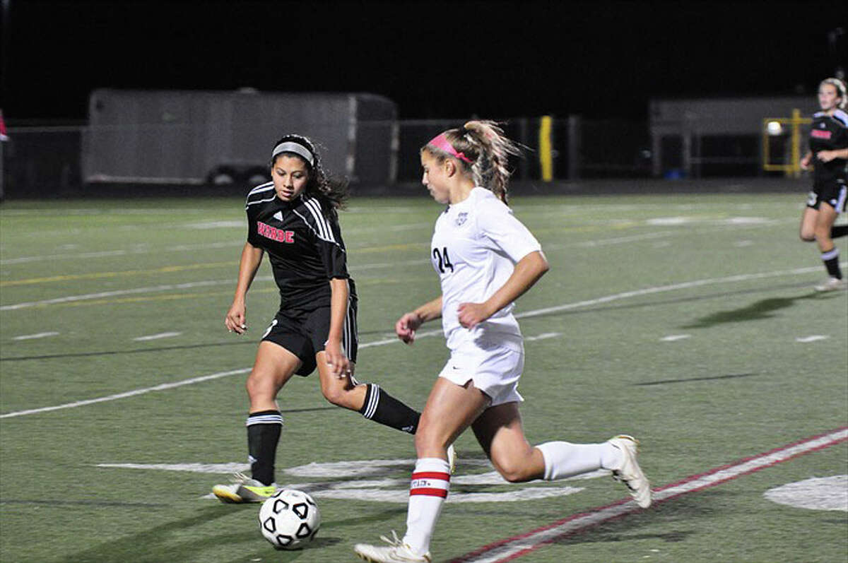 Fairfield Warde defender Julia Delaney cuts off Trumbull's Ana Tantum during the Mustangs' 1-0 win over the Eagles on Thursday, Oct. 11 in Trumbull.
