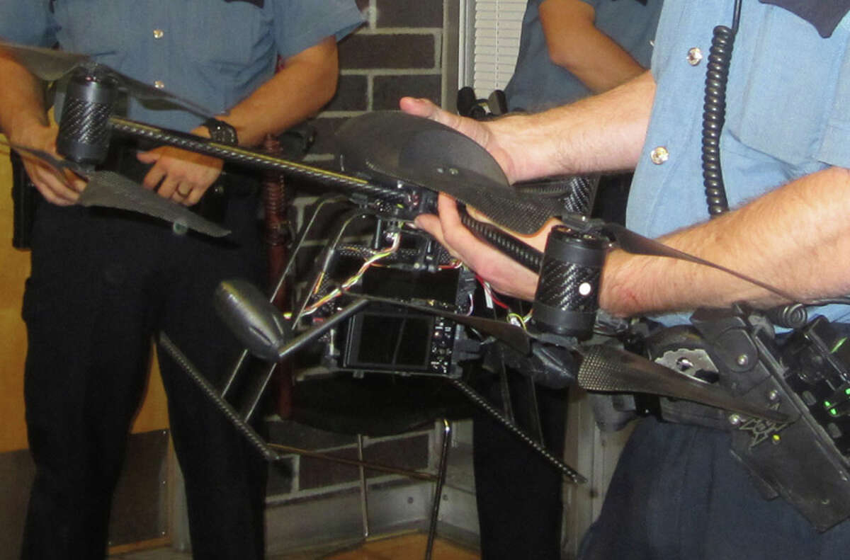 Seattle Police displayed a drone that has the ability to take aerial photos at a maximum of 400 feet. It can run for about 10 minutes. The plan has received mixed reviews, and at an Oct. 25 meeting at the Garfield Community Center several people responded to police by yelling and swearing.