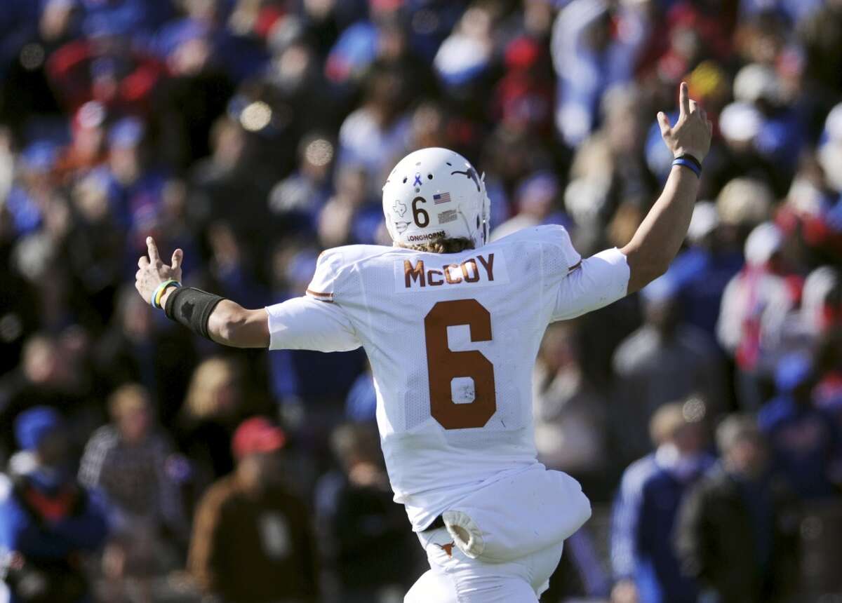 Texas quarterback Case McCoy celebrates after throwing the go-ahead touchdown against Kansas during the second half of NCAA football game, Saturday, Oct. 27,2 012, in Lawrence, Kansas. (AP Photo/The Daily Texan, Lawrence Peart) (Associated Press)