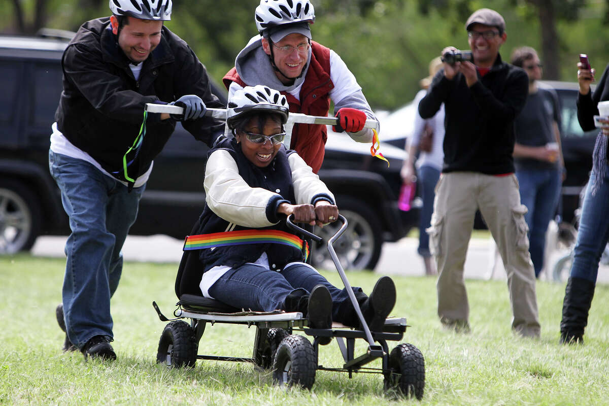 Councilwoman Ivy Taylor is pushed by her staff during the 8th Annual Dignowity Hill Push Cart Derby at Dignowity Hill Park, Saturday, October 27, 2012.