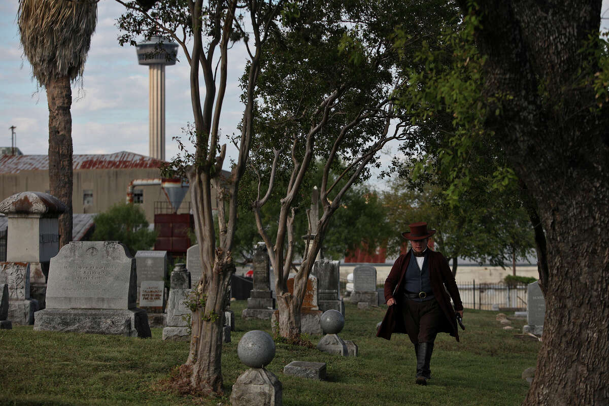 Wade Dillon, a History Interpreter at the Alamo, portrays Samuel Walker during the Go! Historic SA Guided Running and Walking Tour of the historic Eastside Cemeteries on Saturday, Oct. 27, 2012. Walker created the first six shooter, the Walker Colt Revolver, and is buried next to Alamo defenders in the cemetery.