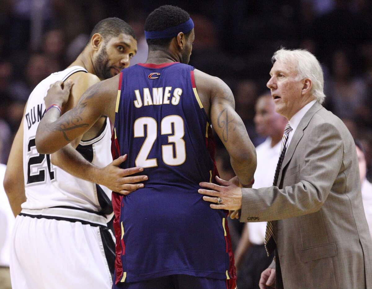 Spurs' Tim Duncan and coach Gregg Popovich talk with Cavaliers' LeBron James after the game Friday March 26, 2010 at the AT&T Center. The Spurs won 102-97. EDWARD A. ORNELAS/Express-News (SAN ANTONIO EXPRESS-NEWS)
