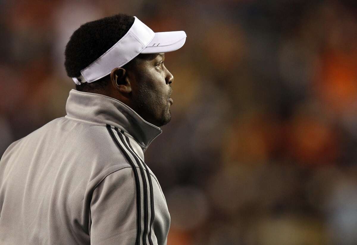 Texas A&M Coach Kevin Sumlin calls in a play from the sideline during the first half of an NCAA college football game against Auburn, Saturday, Oct. 27, 2012, in Auburn, Ala. (AP Photo/Butch Dill) (Associated Press)