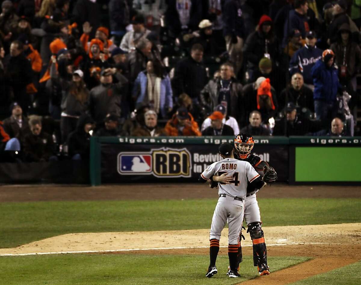 Sergio Romo and Buster Posey hug as the Giants celebrate after the end of the game as they take a 3-0 lead in the World Series. The San Francisco Giants won Game 3 of the World Series against the Detroit Tigers on Saturday, October 27, 2012, in Detroit, Mi. The Giants won the game 2-0.