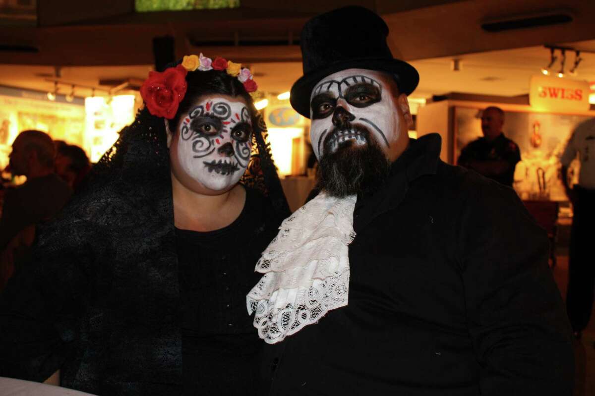 Revelers attend Dance with the Dead at the Institute of Texan Cultures on Saturday night, Oct. 27, 2012.
