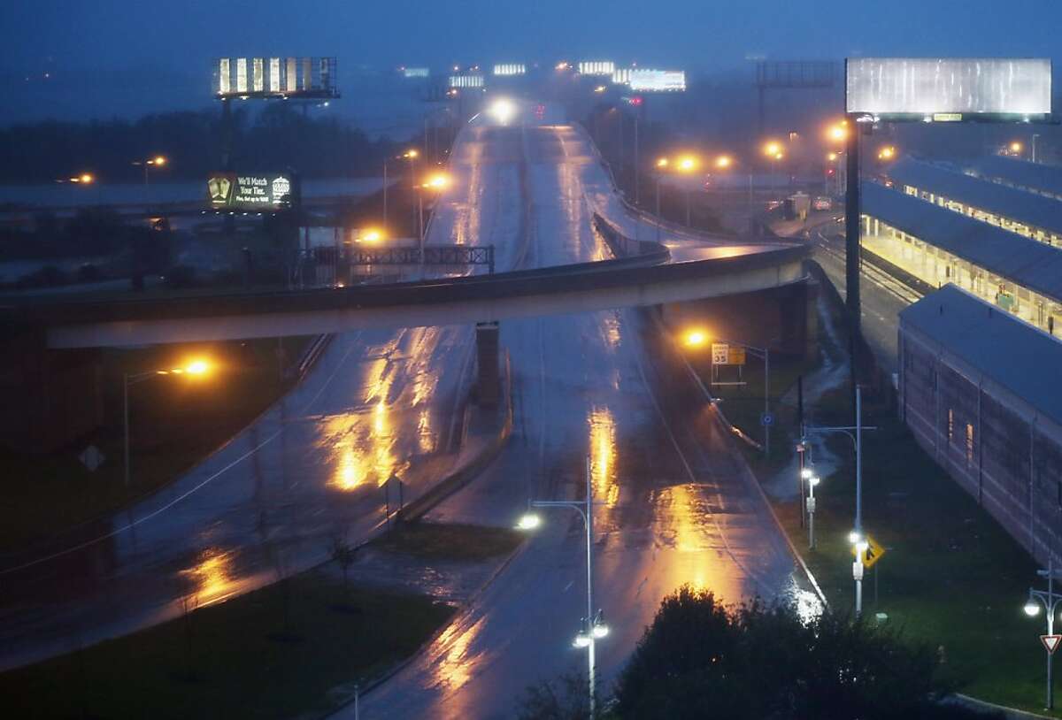 ATLANTIC CITY, NJ - OCTOBER 28: Rain falls on a nearly deserted road ahead of Hurricane Sandy on October 28, 2012 in Atlantic City, New Jersey. Governor Chris Christieâ€™s emergency declaration is shutting down the cityâ€™s casinos and 30,000 residents are being told to evacuate. (Photo by Mario Tama/Getty Images)