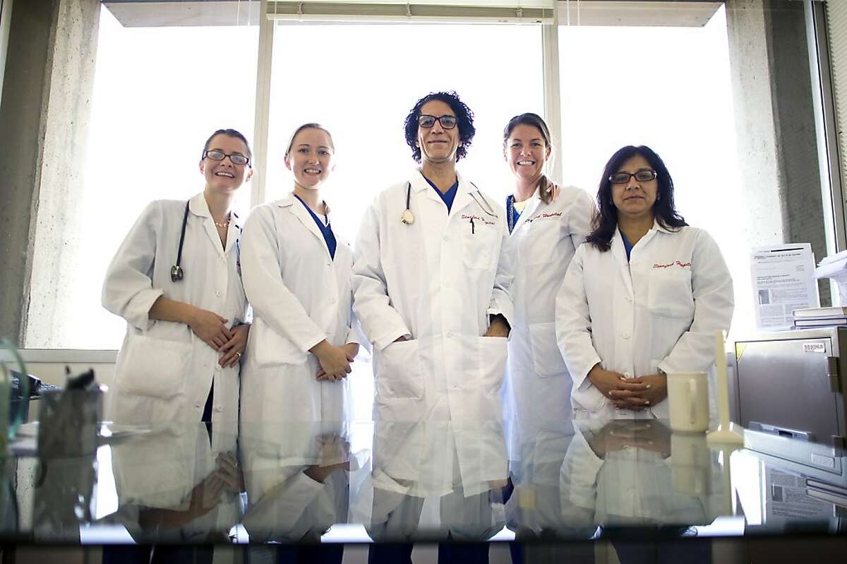 (L-R) Dr.'s Elizabeth Buescher, Amanda Stevens, Camran Nezhat, Jacqualin Miller and Dr. Nezhat's niece, Dr. Azadeh Nezhat pose for a portrait in his office at the Stanford University Medical Center in Palo Alto, CA, Friday October 26th, 2012.
