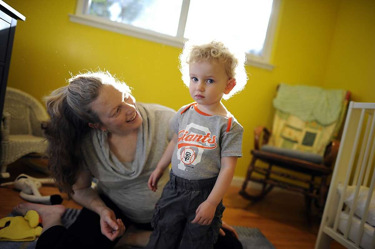 Rebecca Silberstein chats with her son Leo after changing him into his favorite Giants shirt at their home in Sunnyvale, CA, Friday October 26th, 2012. Silberstein, 34, a patient of Dr. Nezhat, was diagnosed with endometriosis in 2009 and underwent surgery to remove three large cysts and many small ones, adhesions, fibroids, and endometriosis on her bladder, bowels and appendix.