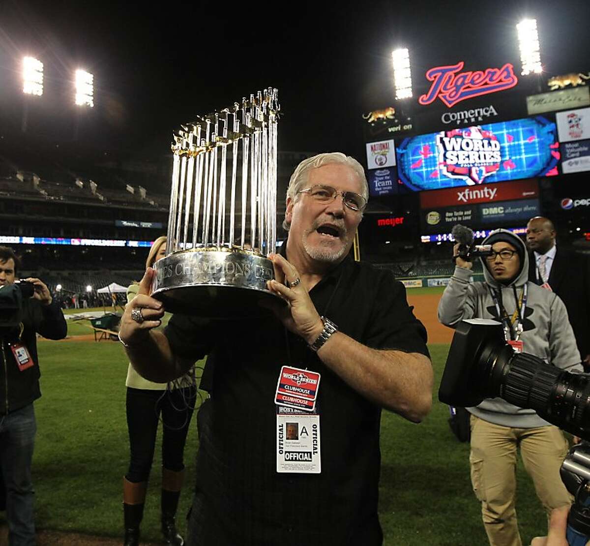 Brian Sabean holds the championship trophy after game 4 of the World Series at Comerica Park on Sunday, Oct. 28, 2012 in Detroit, MI.