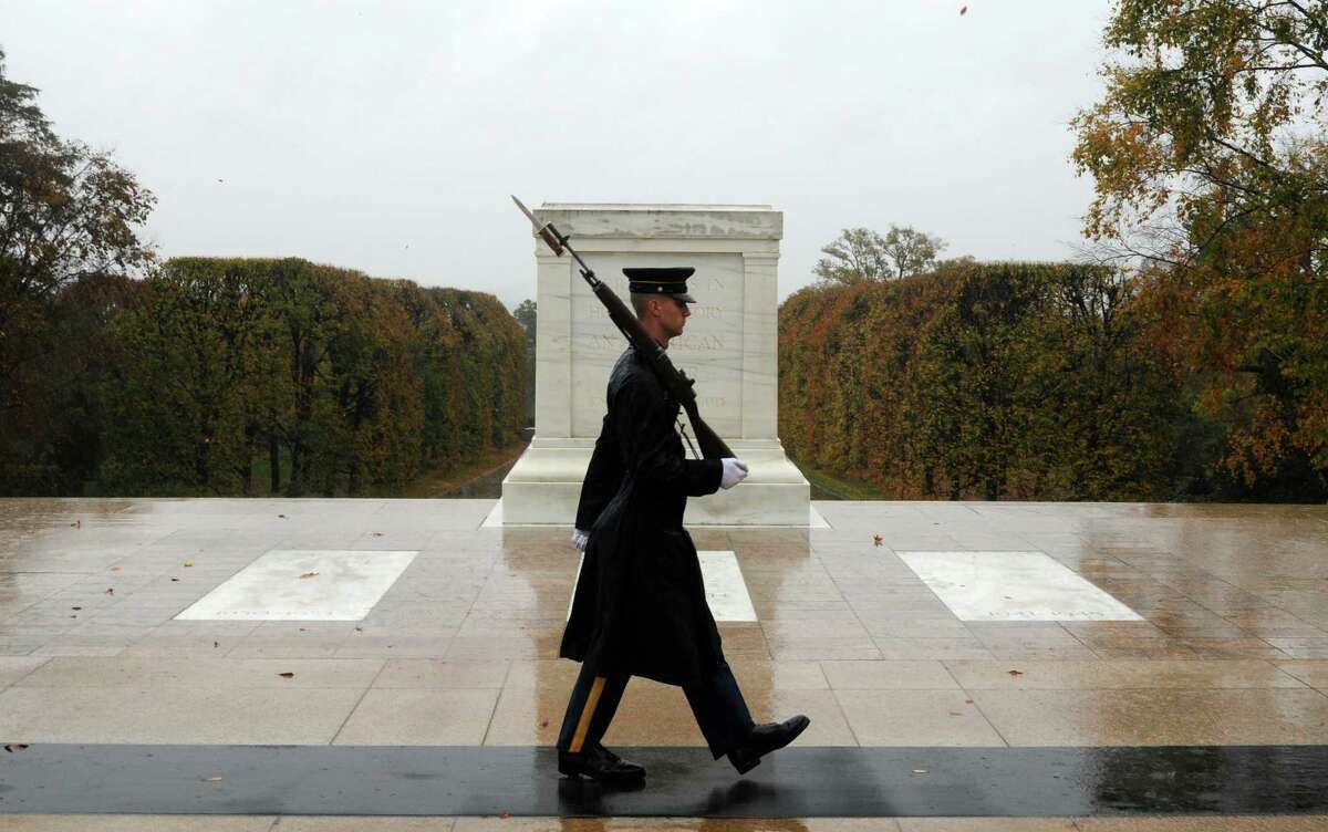 This handout photo provided by the us Army shows Spc. Brett Hyde, Tomb Sentinel, 3d U.S. Infantry Regiment (The Old Guard), keeping guard over the Tomb of the Unknown Soldier during Hurricane Sandy, at Arlington National Cemetery, Va., Monday, Oct. 29, 2012. Just like the Sentinel's Creed says "Through the years of diligence and praise and the discomfort of the elements, I will walk my tour in humble reverence to the best of my ability." (AP Photo/Sgt. Jose A. Torres Jr.,/U.S. Army Photo)