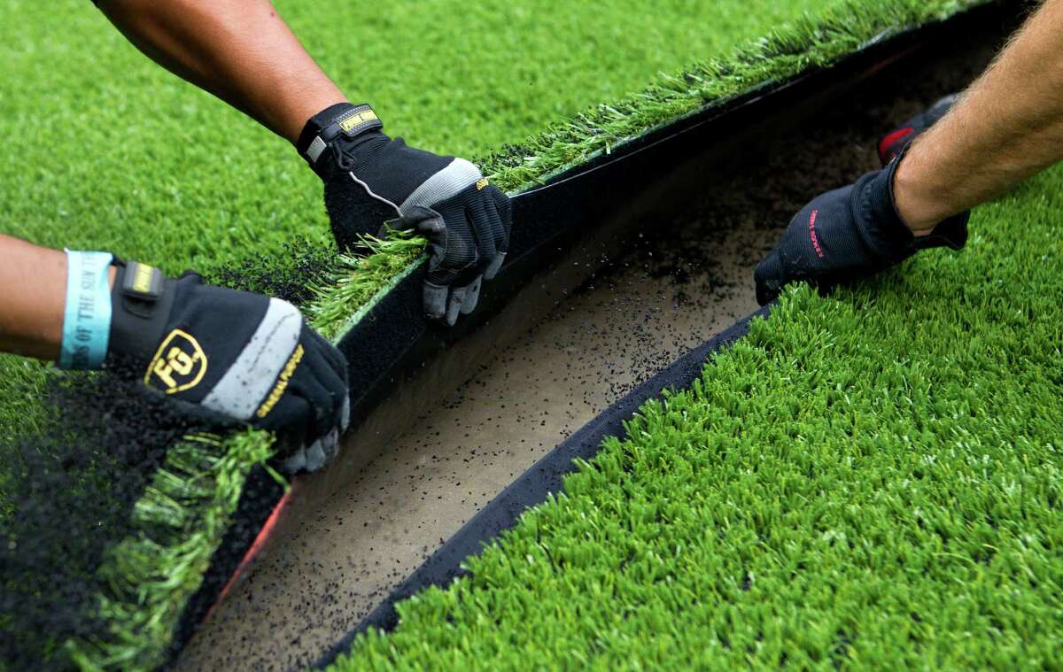 Reliant Stadium adds AstroTurf with state title games in mind