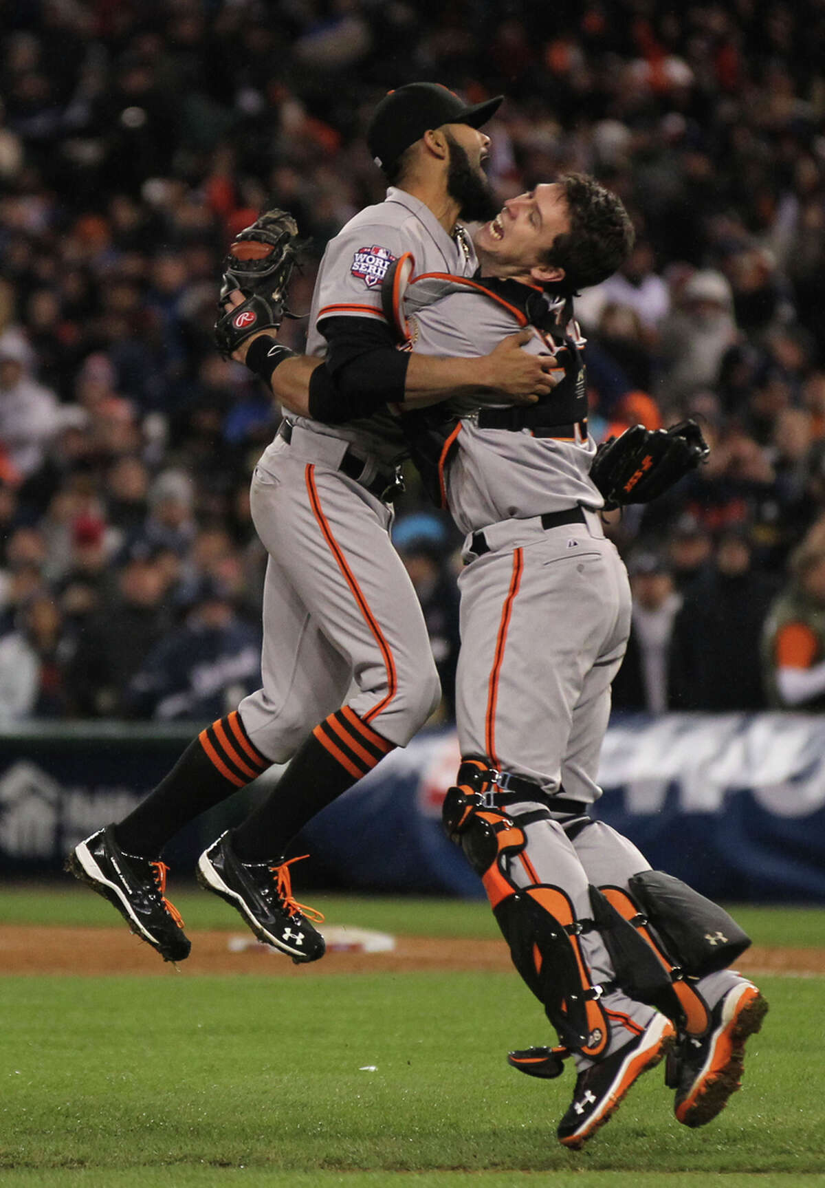 San Francisco Giants Sergio Romo and Buster Posey celebrate their World Series win over the Detroit Tigers at Comerica Park in Detroit, Mi., Sunday, Oct. 28, 2012.