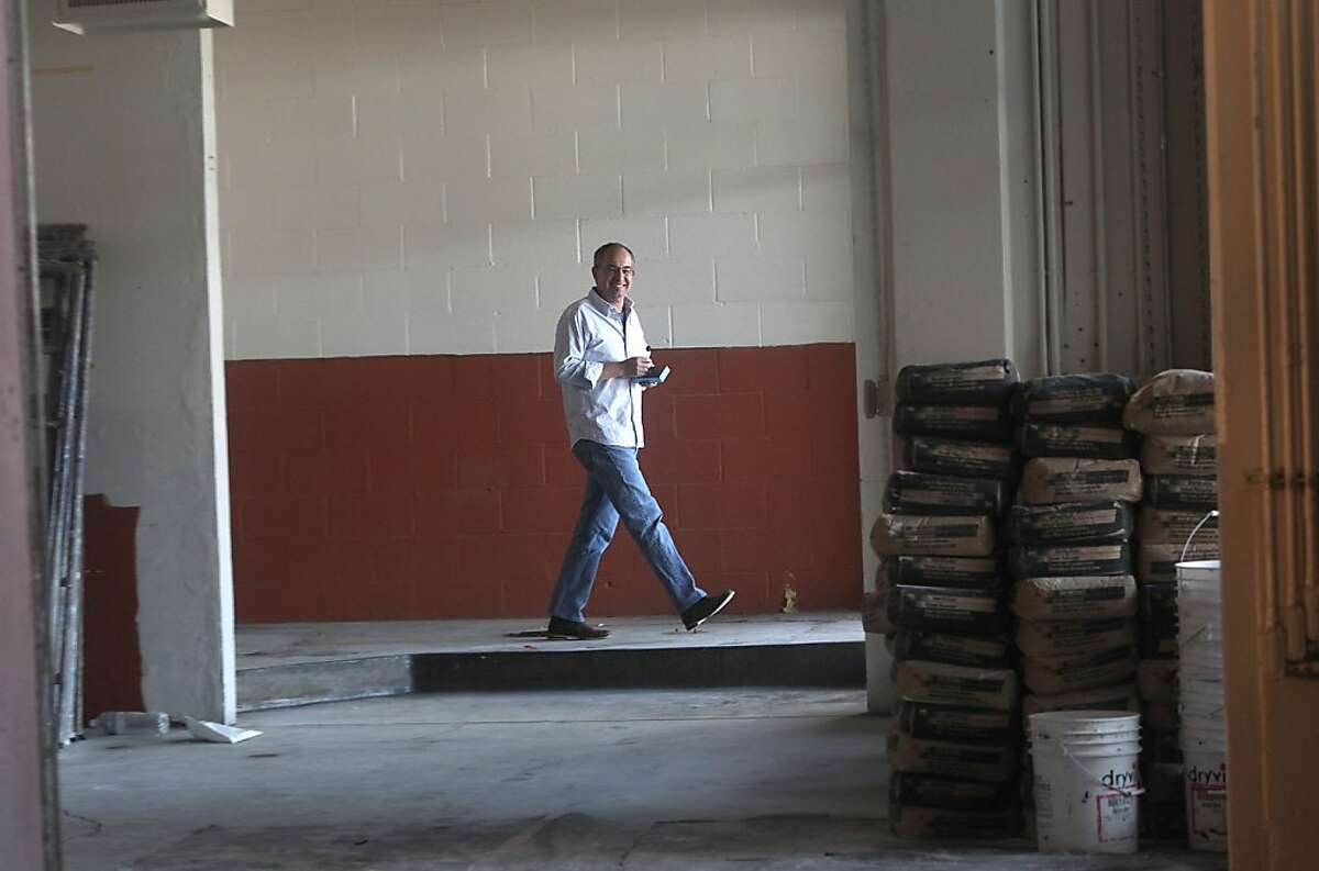 Candy maker Chuck Siegel walking through where his two chocolate panners will be placed in his new factory in San Francisco, Calif., on Wednesday, October 24, 2012.