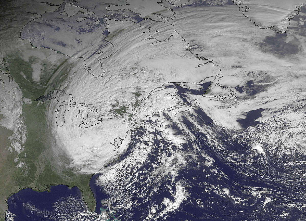 This NOAA satellite image taken Tuesday, Oct. 30, 2012, shows superstorm Sandy slowly moving westward while weakening across southern Pennsylvania. The National Weather Service said a foot and more of snow was reported in lower elevations of West Virginia, where most towns and roads are. High elevations in the mountains were getting more than two feet and a blizzard warning for more than a dozen counties was in effect until Wednesday afternoon. (AP Photo/NOAA)