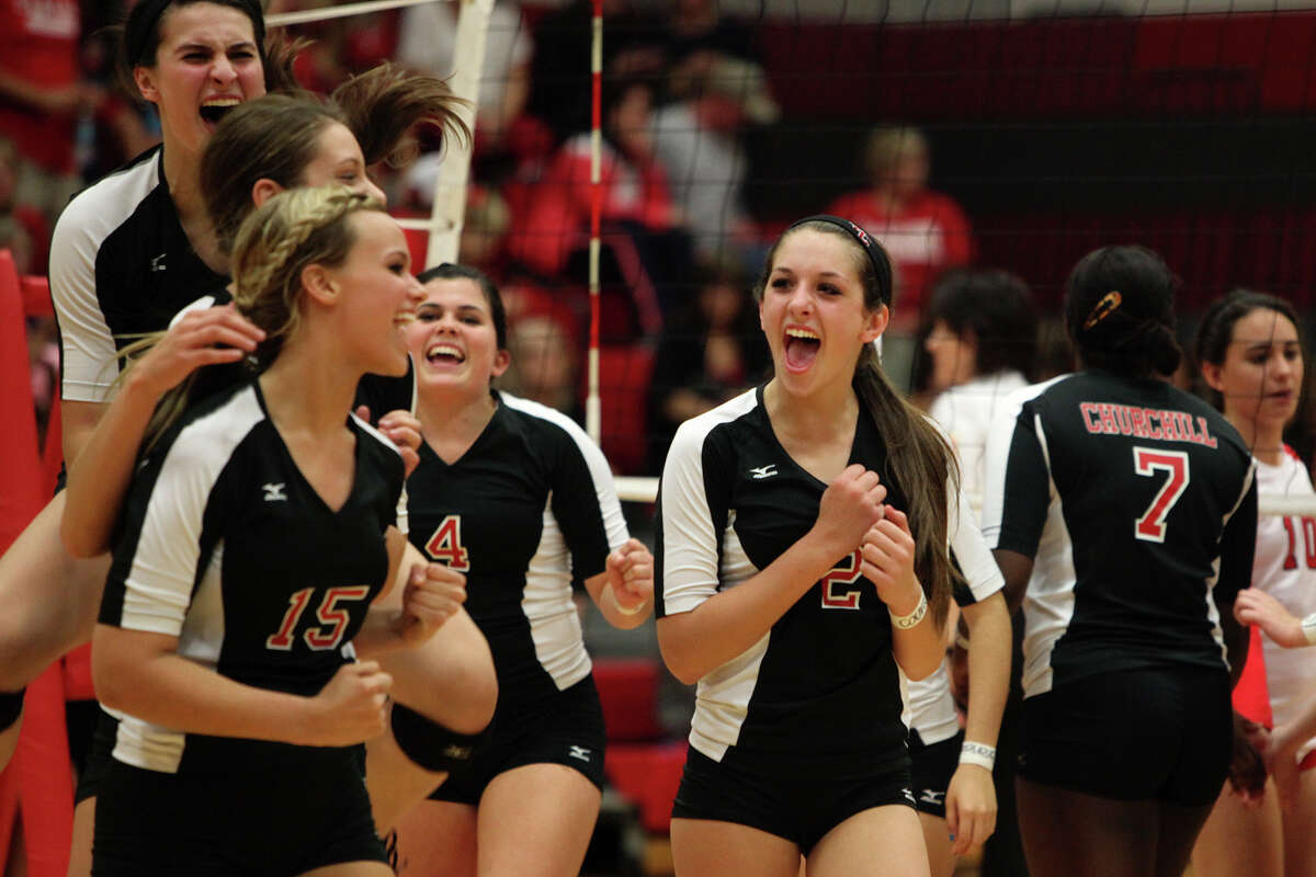 The Churchill volleyball team, including Abby Buckingham, from left, Taylor Martinez, Shelby Arnold, Katie Pope and Karley York celebrates their win against New Braunfels Canyon at the conclusion of their Class 5A first round playoff match at Judson High School on Tuesday, Oct. 30, 2012.