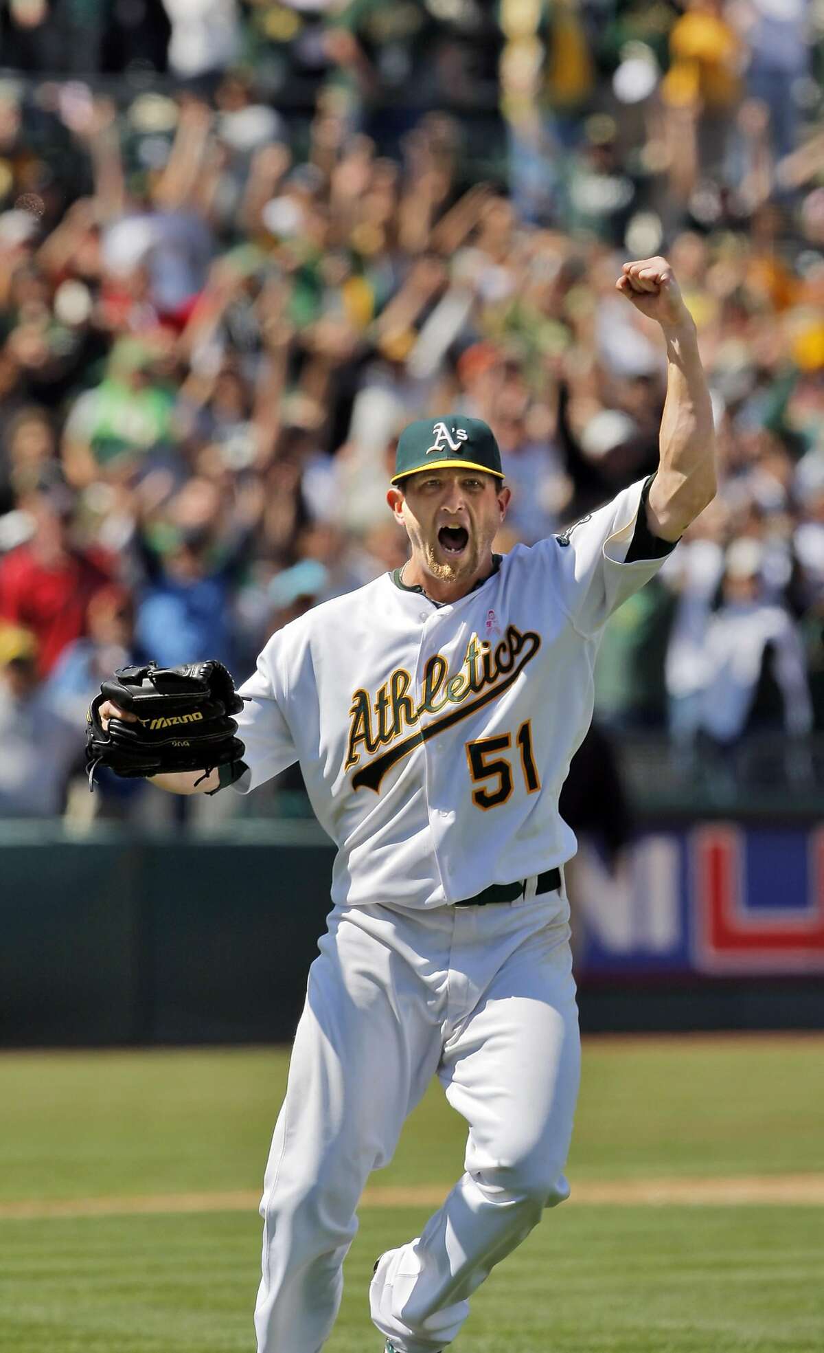 Dallas Braden reacts to the last out in a game against the Tampa Bay Rays in which he pitched a perfect game, the 19th in MLB history. 
