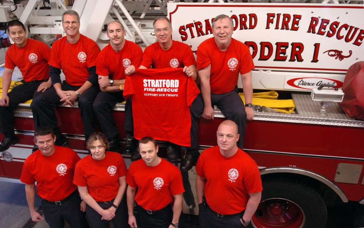 Stratford firefighters are taking part in the Red Shirt Friday program which encourages people to wear red shirts on Fridays to show support for American troops. The fire department's usual blue t-shirts were replicated in red and "Support Our Troops" was added to the back of the shirts. Clockwise from top left is Garvin Yu, Lt. Jim Mecozzi, Stephen O'Hara, Mike Preston, Mike Tiberio, Jason Carrafiello, Adam Hittinger, Asst. Chief Ellen Murray and Ray Hessels.