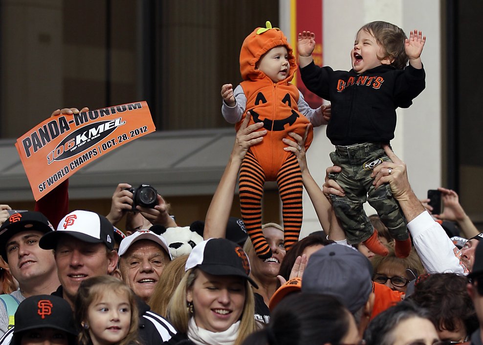 SFGATE - Giants pitcher Matt Cain, wife Chelsea and daughter Hartley wave  during the World Series victory parade on Wednesday, October 31, 2012 in  San Francisco, Calif. (Beck Diefenbach/Special to the Chronicle)