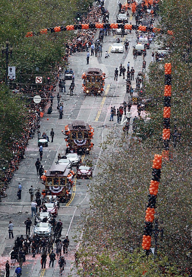 SFGATE - Giants pitcher Matt Cain, wife Chelsea and daughter Hartley wave  during the World Series victory parade on Wednesday, October 31, 2012 in  San Francisco, Calif. (Beck Diefenbach/Special to the Chronicle)