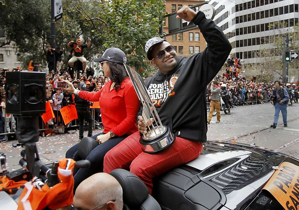 Pablo Sandoval and Kseniya Blayakherova shared the backseat with his MVP trophy. The San Francisco Giants celebrated their second World Series title in three years with a parade down Market Street Wednesday October 31, 2012.