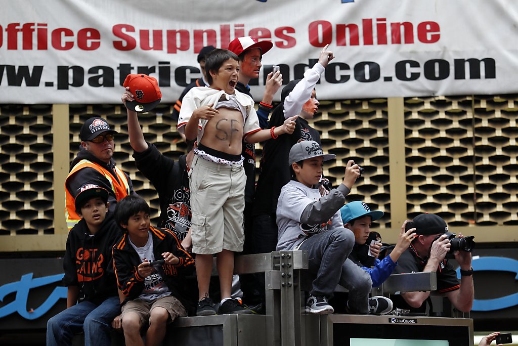 SFGATE - Giants pitcher Matt Cain, wife Chelsea and daughter Hartley wave  during the World Series victory parade on Wednesday, October 31, 2012 in  San Francisco, Calif. (Beck Diefenbach/Special to the Chronicle)