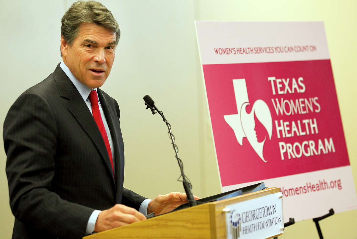 Texas Gov. Rick Perry and Texas Health and Human Services Commissioner Kyle Janek announce at a press conference at the Lone Star Circle of Care center in Georgetown, Texas, Wednesday Oct. 31, 2012, that the state-funded Texas Women's Health Program is ready to begin providing preventative health services to low-income Texas women.(AP Photo/American-Statesman, Ralph Barrera)