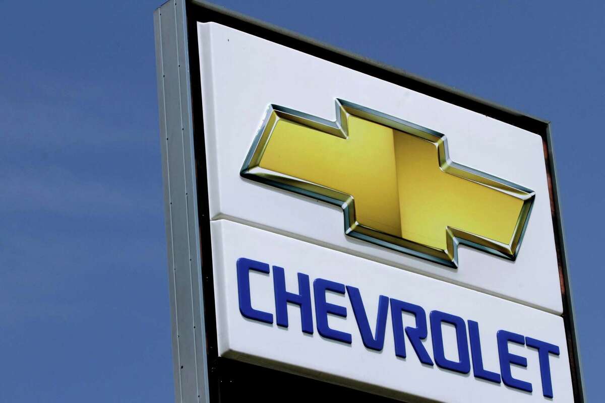 This July 8, 2012 , photo shows the Chevrolet logo at an auto dealership in Springfield, Ill. A turnaround in South America and a rosier outlook in Europe helped push General Motors shares up Wednesday, July 31, 2012, even though the company's third-quarter net profit fell 14 percent. GM said it earned $1.48 billion from July through September, down from $1.73 billion a year earlier, as European pretax losses widened and North American profits fell. (AP Photo/Seth Perlman)