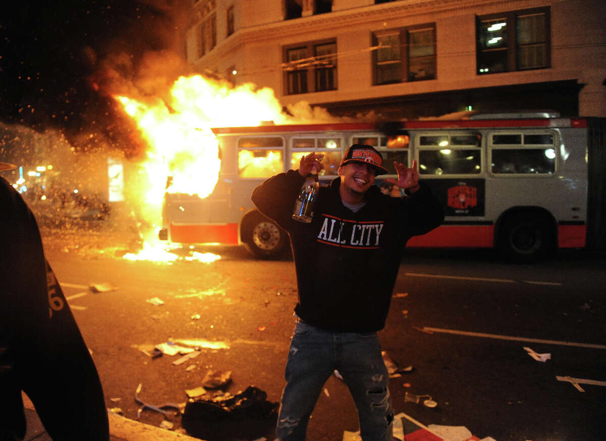 A bus is set on fire in San Francisco after the Giants won the World Series on October 28, 2012.