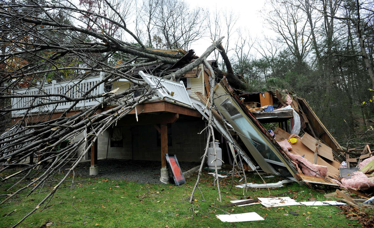 This house in the Lake Waubeeka community in Danbury, Conn., was heavily damaged by falling trees during Hurricane Sandy.