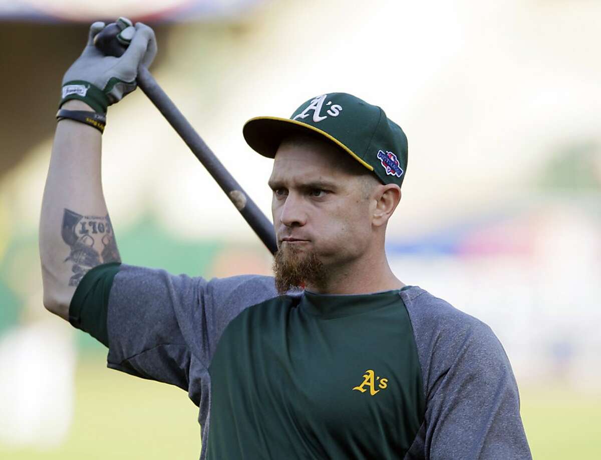 Oakland Athletics left fielder Jonny Gomes warms up before Game 4 of an American League division baseball series against the Detroit Tigers in Oakland, Calif., Wednesday, Oct. 10, 2012. (AP Photo/Eric Risberg)