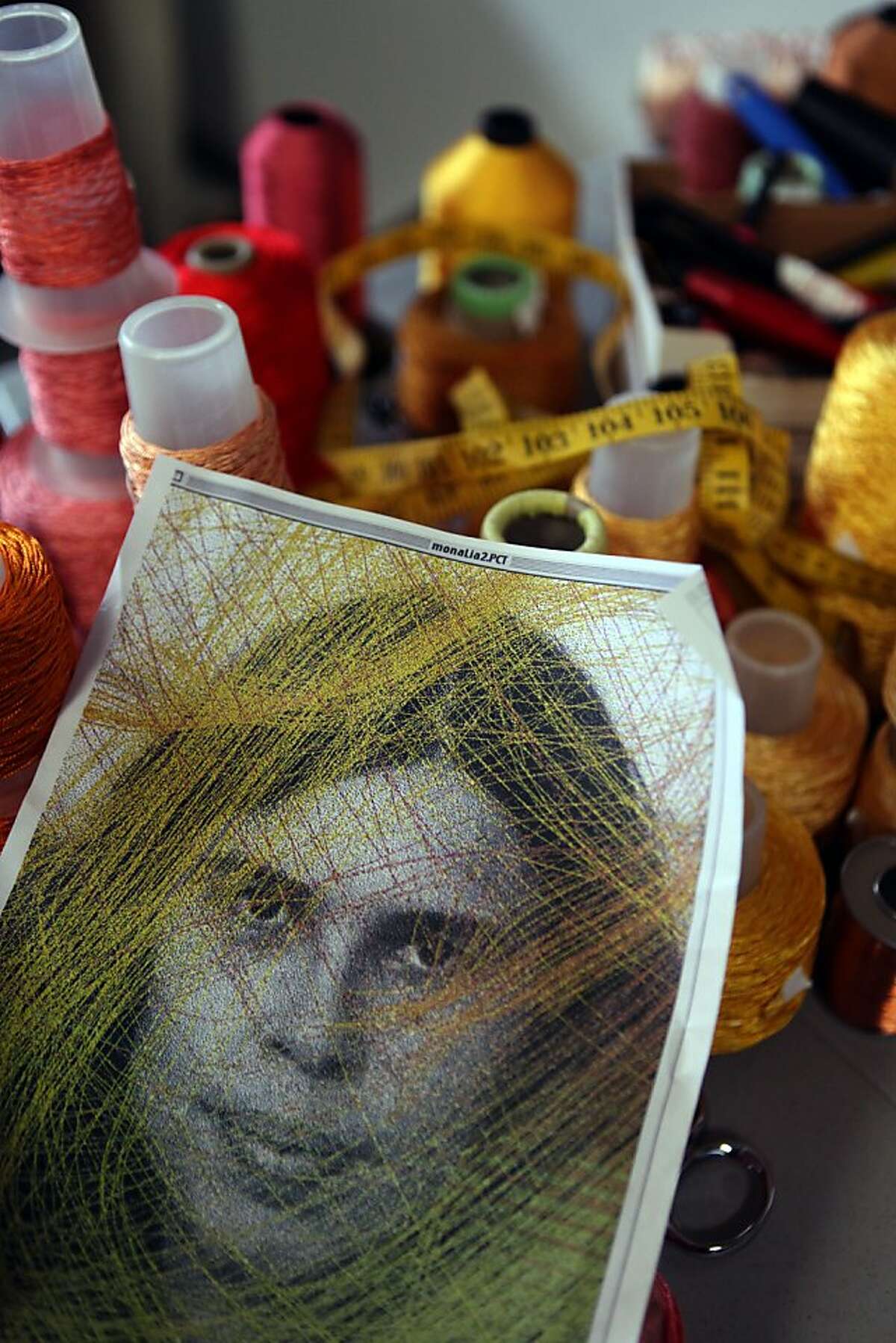 Berkeley textile artist Lia Cook showed an image of what she is recently weaving at her studio in Berkeley, Calif., on Tuesday, October 30, 2012. The picture is of herself during her 20's.