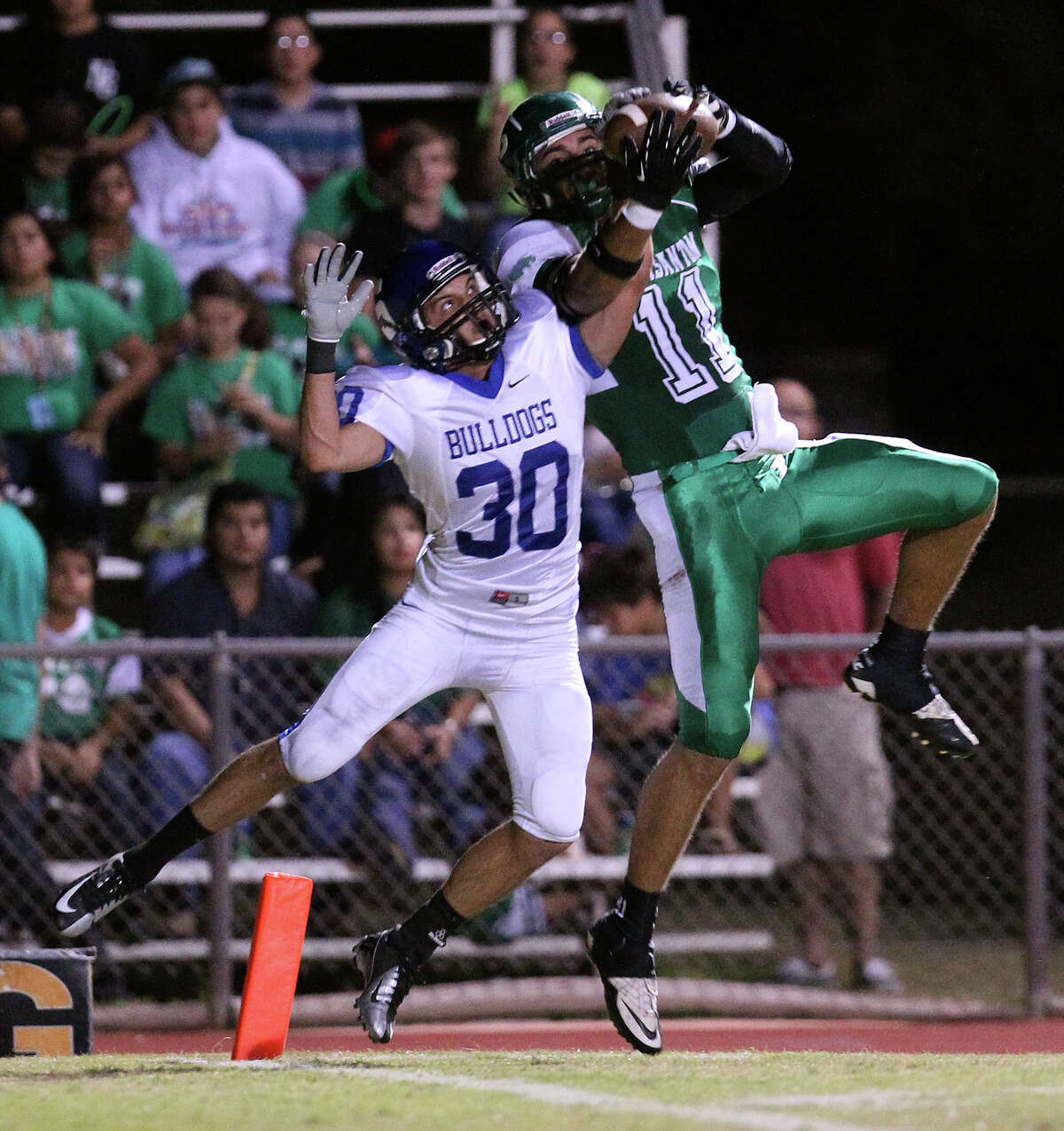 Pleasanton's Jacob Jandt (11) grabs a pass for a touchdown against Somerset's Hunter Dorman (30) in the first half in high school football in Pleasanton on Friday, Nov. 2, 2012.