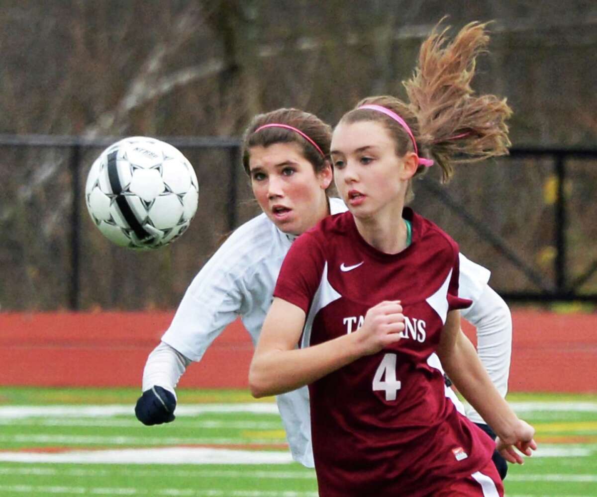 Burnt Hills' #11 Skye Kaler, left, and Scotia-Glenville's #4 Max Culhane during the sectional girls' soccer final at Stillwater High School Saturday Nov. 3, 2012. (John Carl D'Annibale / Times Union)