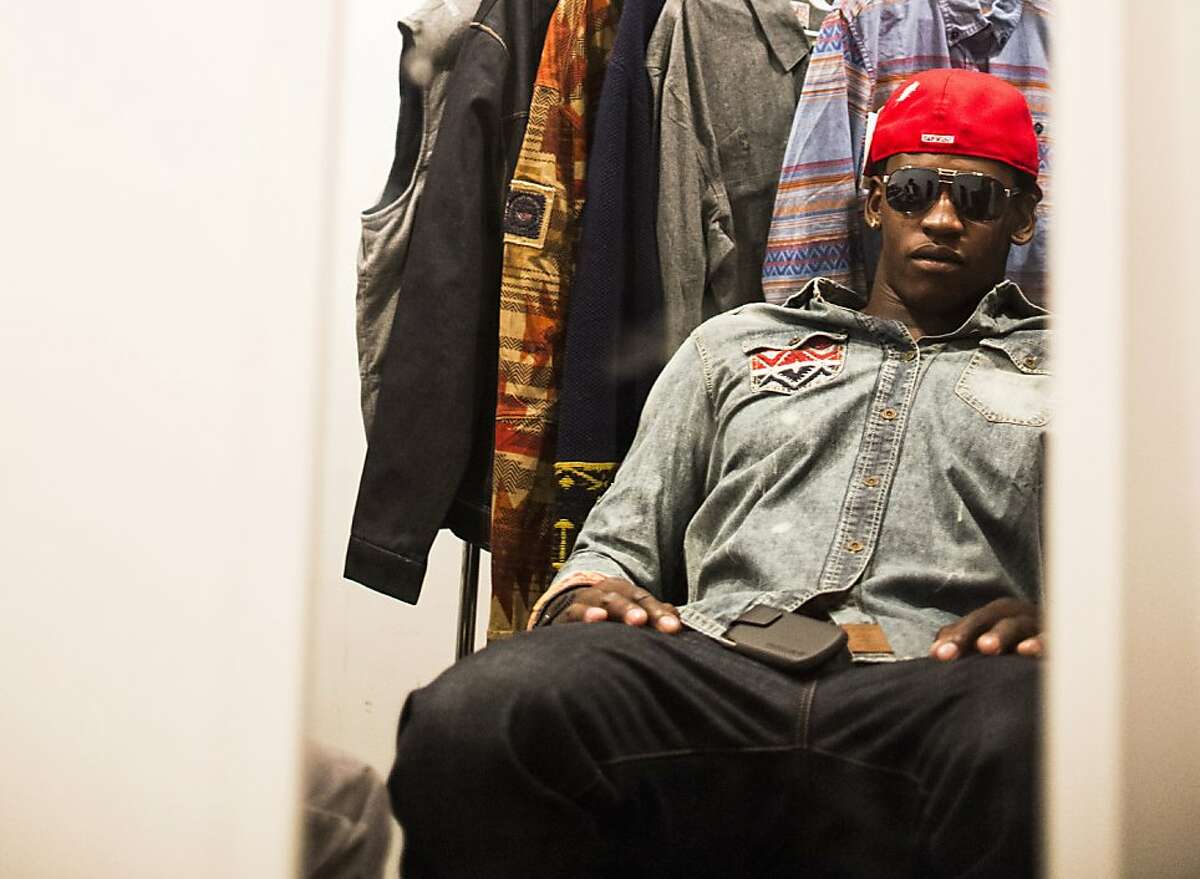 49ers linebacker Aldon Smith, tries on hats and sunglasses recommended by "Hypebeasts" costume designer Haley Lieberman on set in New York City.
