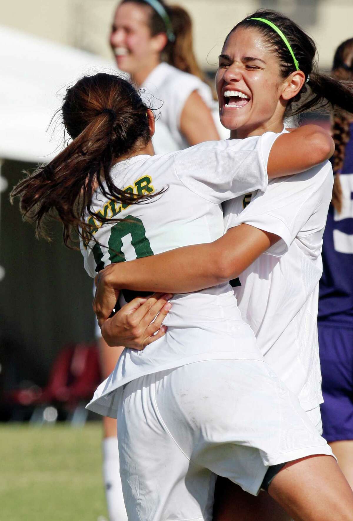 Baylor's Bri Campos (left) celebrates with Larissa Campos after Larissa scored a goal during second half action againt TCU Sunday Nov. 4, 2012 during the 2012 Big 12 Soccer Championship match. Baylor won 4-1.