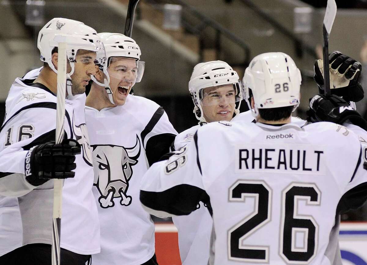 San Antonio Rampage players Andre Deveaux, from left, Alex Petrovic, John McFarland, and Jon Rheault celebrate a second period goal by Petrovic during an AHL hockey game against the Oklahoma City Barons, Sunday, Nov. 4, 2012, in San Antonio.
