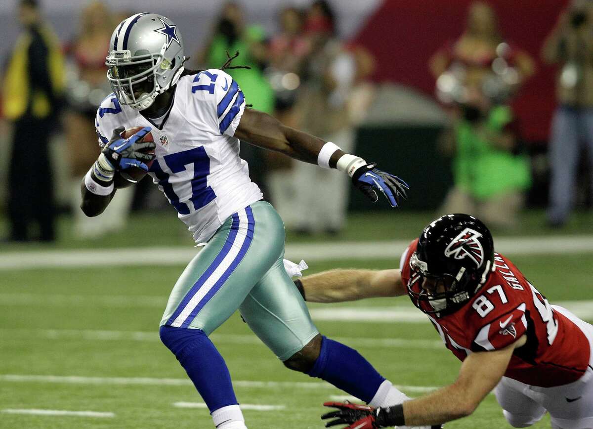 Dallas Cowboys wide receiver Dwayne Harris (17) breaks away from Atlanta Falcons tight end Tommy Gallarda (87) as he returns a punt during the first half of an NFL football game, Sunday, Nov. 4, 2012, in Atlanta. (AP Photo/Chuck Burton)