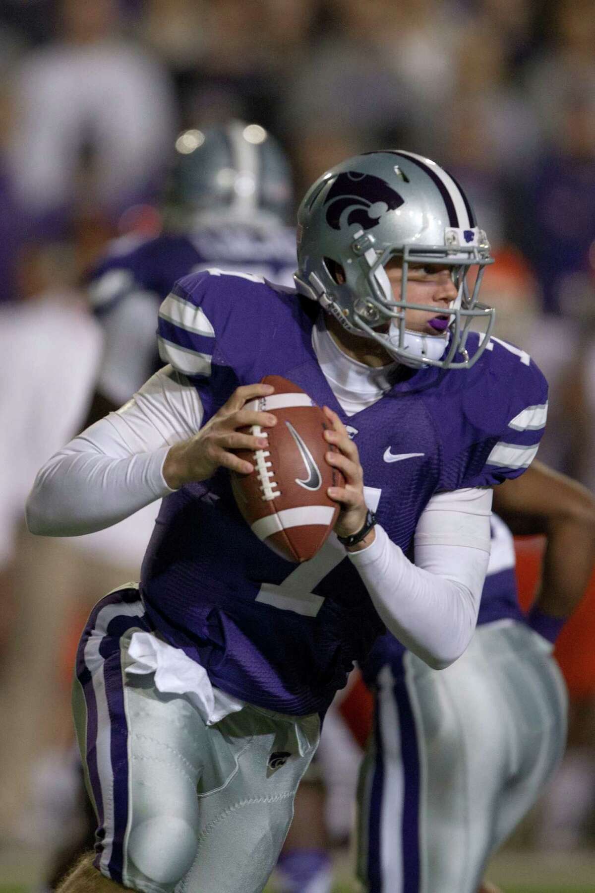 Kansas State quarterback Collin Klein (7) during the first half of an NCAA college football game against Oklahoma State in Manhattan, Kan., Saturday, Nov. 3, 2012. (AP Photo/Orlin Wagner)