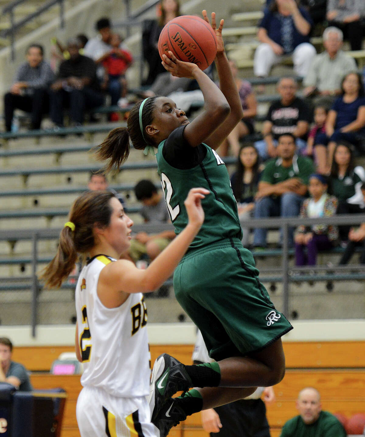 Reagan's Moriah Mack (32) takes a shot during a girls non-district basketball game between the Brennan Bears and the Reagan Rattlers at Paul Taylor Field House in San Antonio, Saturday, November 5, 2012. John Albright / Special to the Express-News.