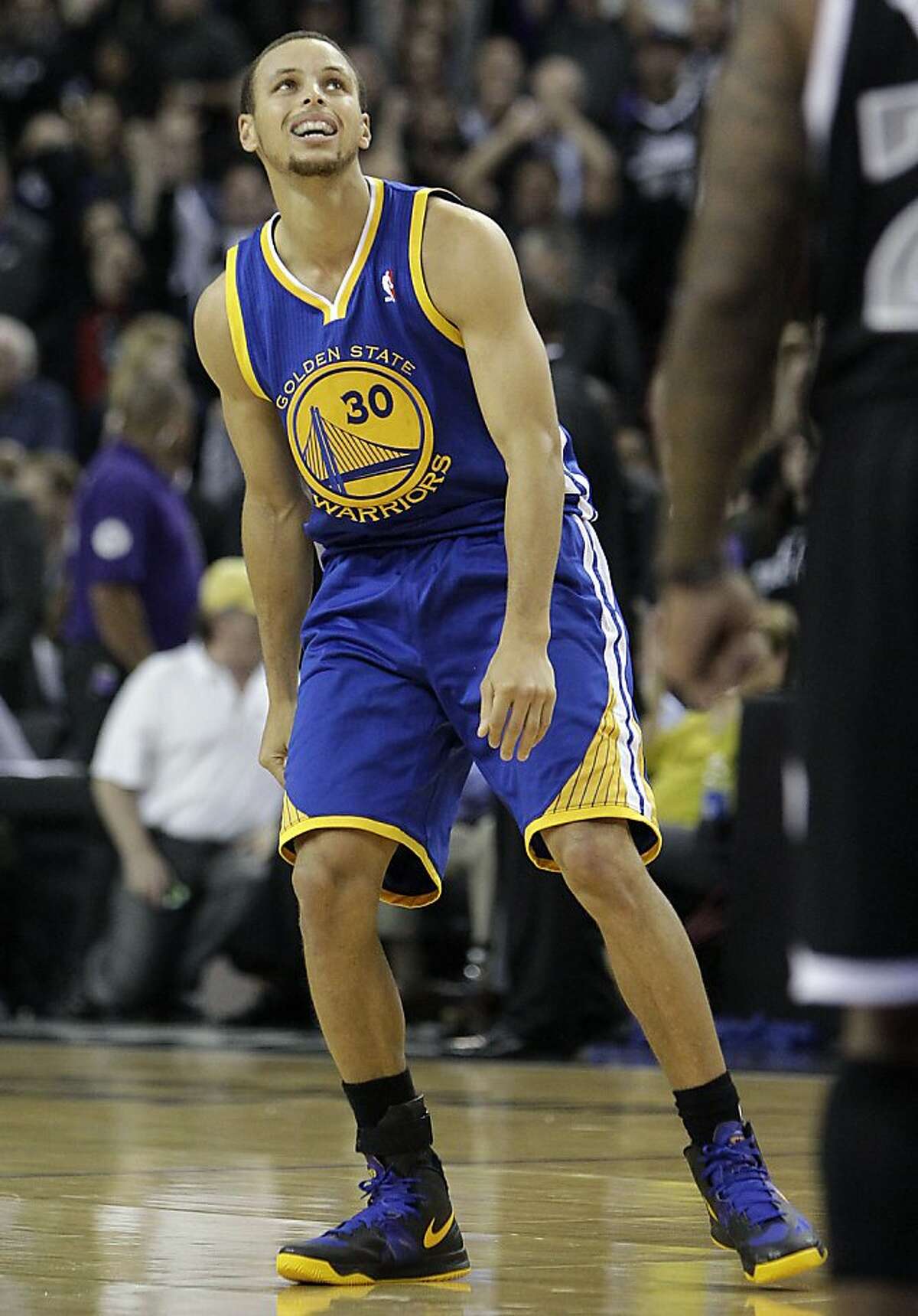 Golden State Warriors guard Stephen Curry watches his missed shot against the Sacramento Kings basket during the final moments of an NBA basketball game in Sacramento, Calif., Monday, Nov. 5, 2012. The Kings won 94-92. (AP Photo/Rich Pedroncelli)