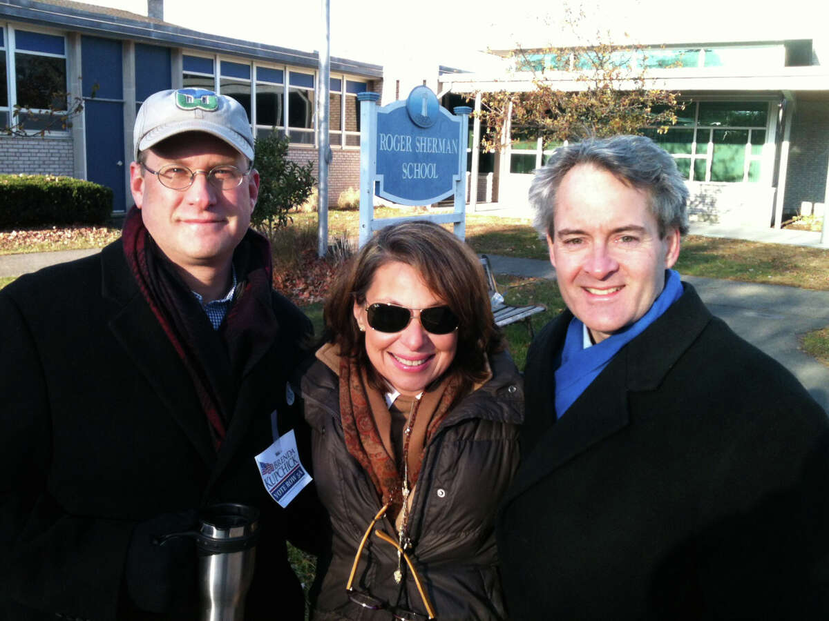 Michael Mears and Dorothy Domeika, former members of the Representative Town Meeting, and former state Rep. Thomas Drew outside Roger Sherman School on Tuesday morning to show support for candidates in Tuesday's election. Fairfield CT 11/6/12
