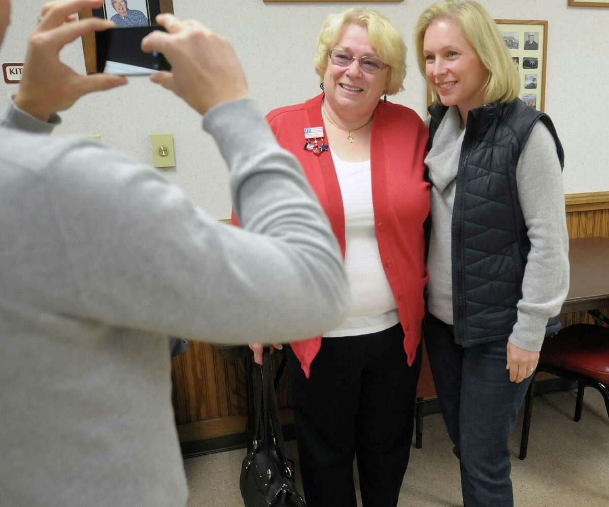Sherry Butler, left, of Brunswick has her photograph taken with U.S. Sen. Kirsten Gillibrand after the two women voted Tuesday morning at the Brunswick No. 1 Fire House. (Paul Buckowski / Times Union)
