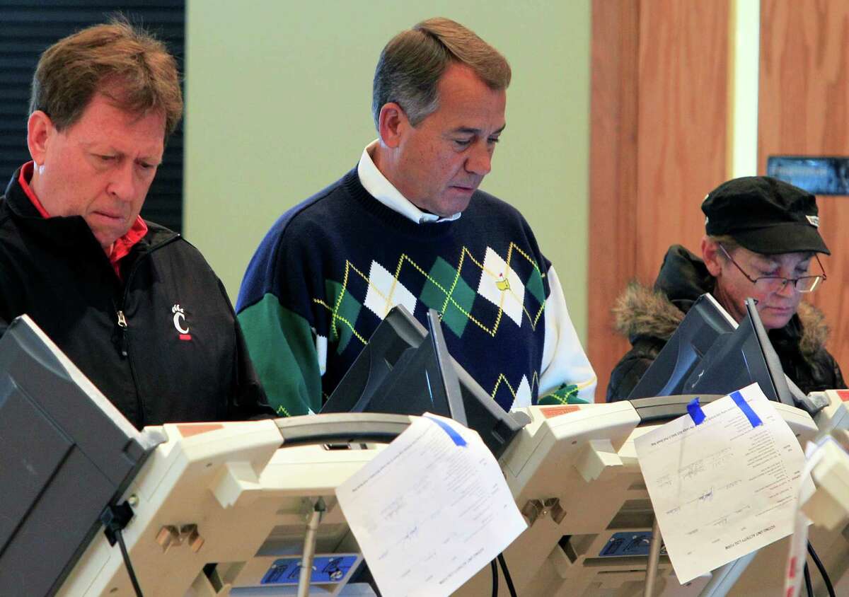 Speaker John Boehner, R-Ohio, center, votes at Ronald Reagan Lodge, Tuesday, Nov. 6, 2012, in West Chester, Ohio. After a grinding presidential campaign, Americans head into polling places across the country. (AP Photo/Al Behrman)