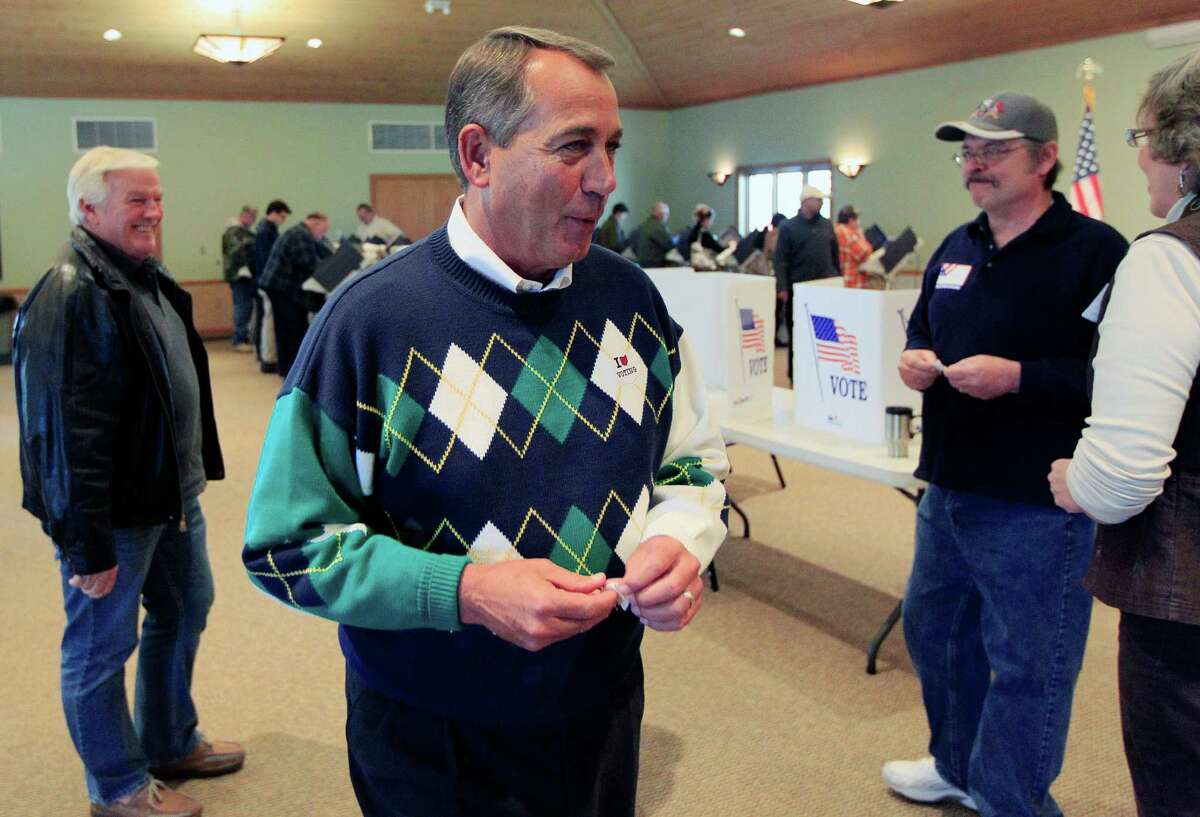 House Speaker John Boehner (R-Ohio) talks with poll workers after voting at Ronald Reagan Lodge, Tuesday, Nov. 6, 2012, in West Chester, Ohio. (AP Photo/Al Behrman)