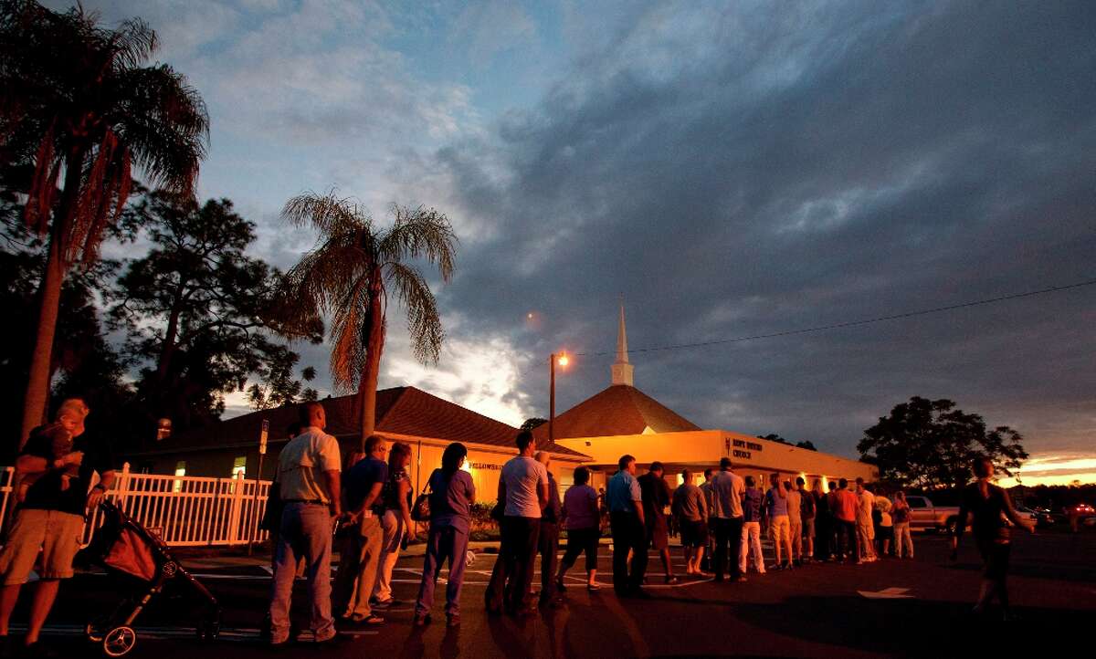 Voters stand in line at a Fort Myers, Fla. church late Tuesday, Nov. 6, 2012. After a grinding presidential campaign President Barack Obama and Republican presidential candidate, former Massachusetts Gov. Mitt Romney, yield center stage to American voters Tuesday for an Election Day choice that will frame the contours of government and the nation for years to come. (AP Photo/J Pat Carter)