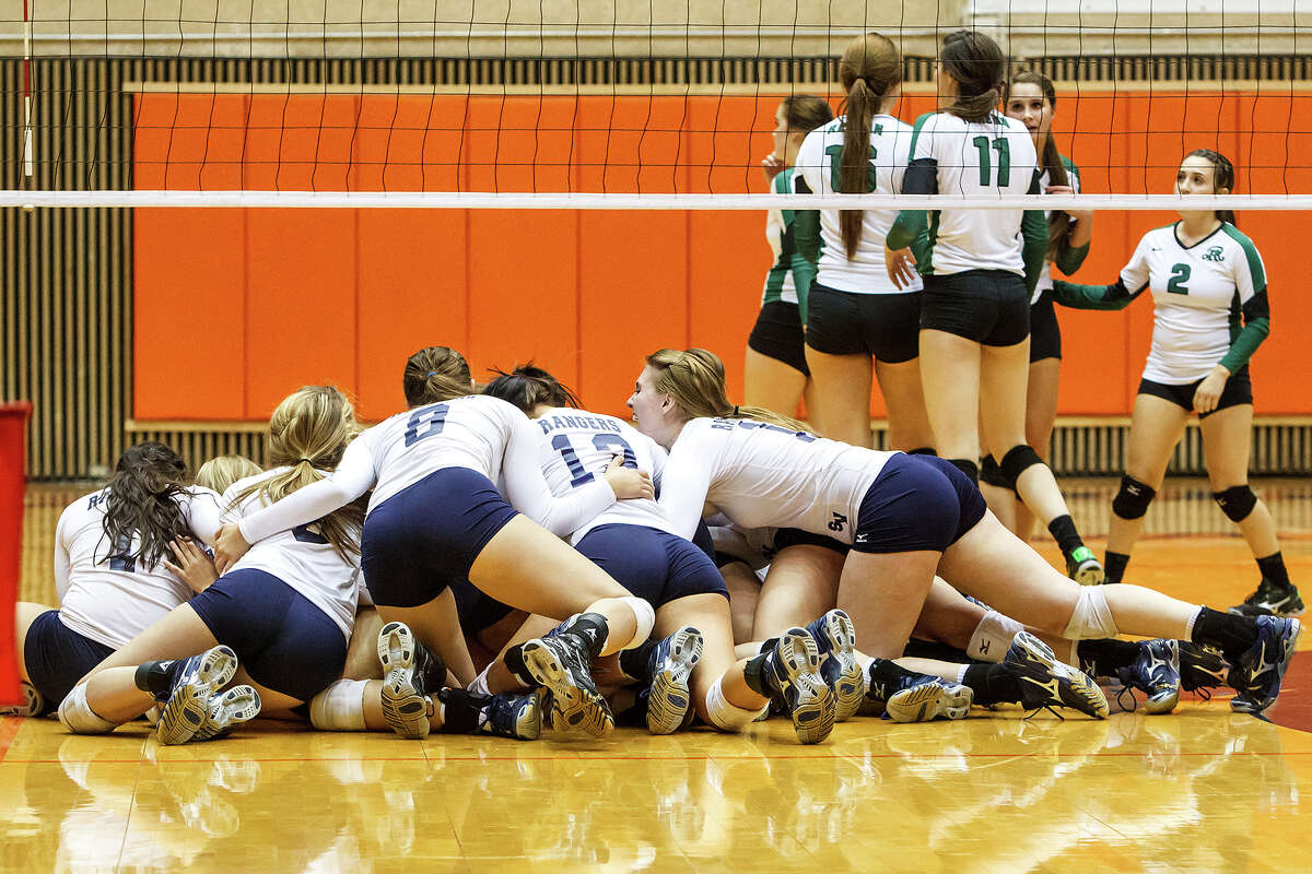 The Smithson Valley Lady Rangers celebrate their victory over Reagan during their Class 5A third round volleyball match at the UTSA Convocation Center on Nov. 6, 2012. Smithson Valley won the match in three straight sets: 25-23, 25-21 and 25-19. MARVIN PFEIFFER/ mpfeiffer@express-news.net